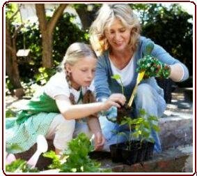 Kids earning about nature - Mother and daughter in garden
